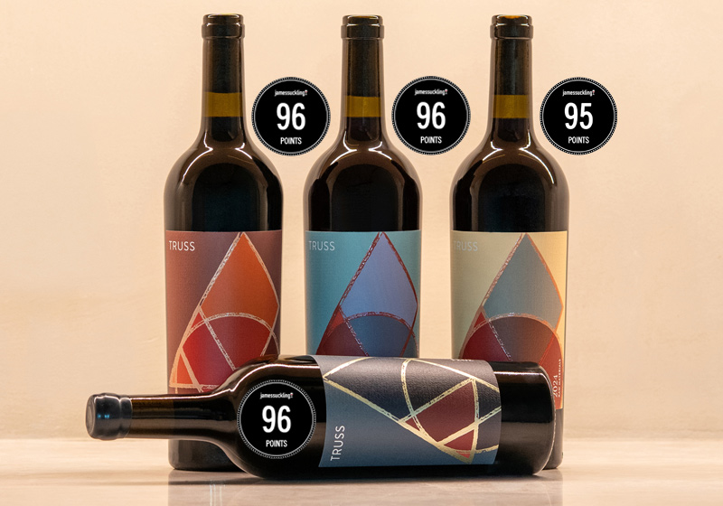 high scoring wines with wine bottles, with elegant labels and numbered scores pictured on a nice background